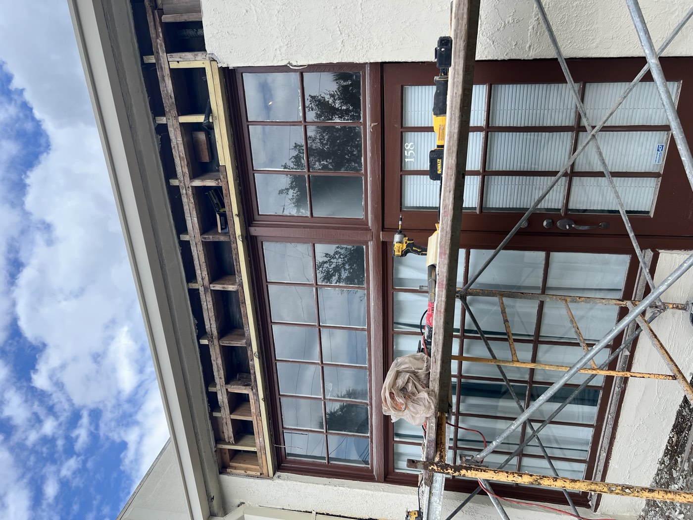 New wood framing installed above the storefront windows