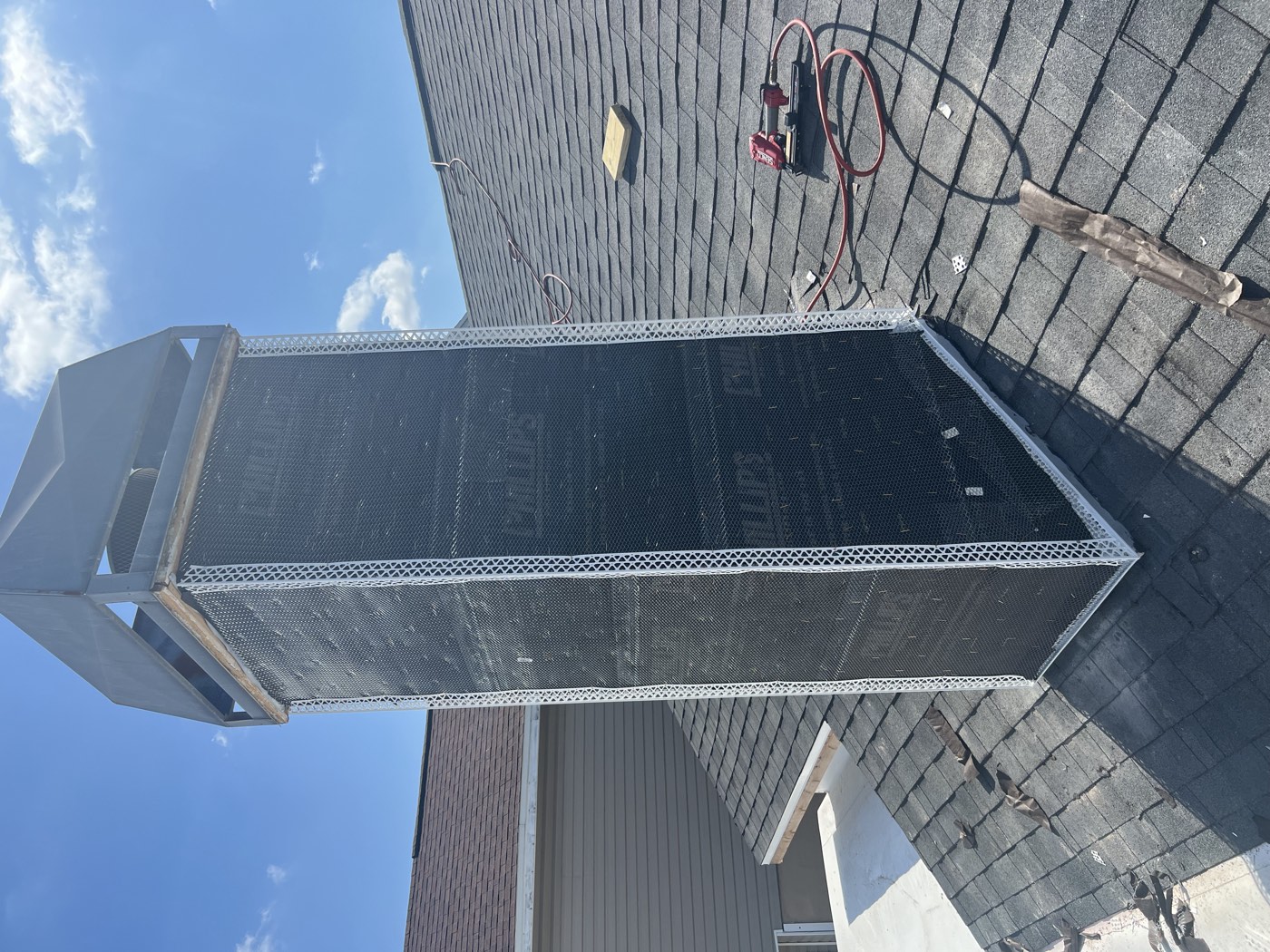 The chimney wrapped in new paper and metal lath