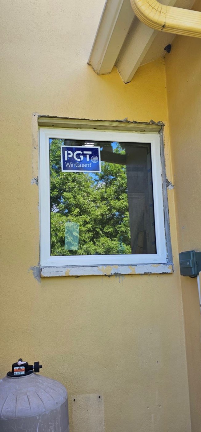 A newly installed window with a rough, unfinished edge around it